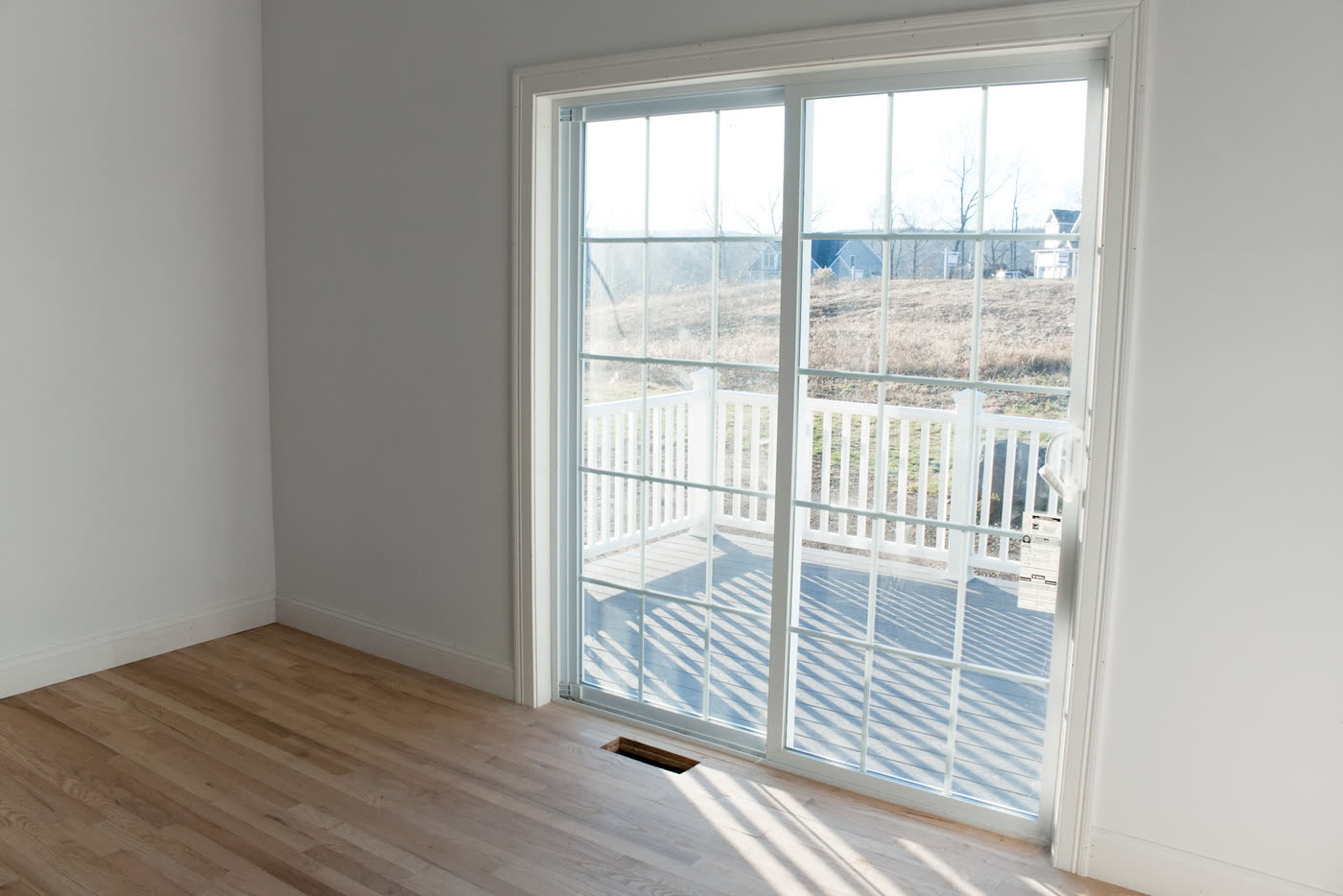 A two-panel sliding glass door opening onto a deck